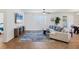Spacious living room with tile flooring, a large window, and a comfortable sofa at 115 64Th E Ave, Bradenton, FL 34203