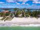 Aerial view showcases beach access to waterfront homes near the shore at 1216 N Casey Key Rd, Osprey, FL 34229