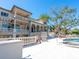 Expansive backyard featuring pool, spa, lounge chairs, and serene views of the lush surroundings at 1216 N Casey Key Rd, Osprey, FL 34229
