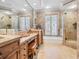 Well-appointed bathroom featuring a soaking tub and separate shower at 1216 N Casey Key Rd, Osprey, FL 34229