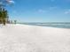 Expansive white sand beach with clear blue water, perfect for relaxation and recreation at 1216 N Casey Key Rd, Osprey, FL 34229