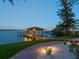 Picturesque dock with a boat lift and covered area, perfect for enjoying the waterfront at 1216 N Casey Key Rd, Osprey, FL 34229