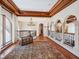 Landing with hardwood flooring, wood trim, wrought iron railing and a decorative bench at 1216 N Casey Key Rd, Osprey, FL 34229