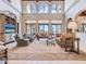 Bright living room featuring large windows, comfortable seating, and elegant decor, perfect for relaxation and entertaining at 1216 N Casey Key Rd, Osprey, FL 34229