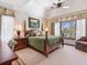 Inviting main bedroom with a vaulted ceiling, large windows, and scenic views at 1216 N Casey Key Rd, Osprey, FL 34229
