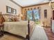 Serene main bedroom with access to a private balcony and stunning ocean views at 1216 N Casey Key Rd, Osprey, FL 34229