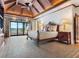 Main bedroom suite with vaulted ceilings, a ceiling fan, a king-sized bed, and water views at 1216 N Casey Key Rd, Osprey, FL 34229