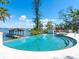Zero entry pool and hot tub with bay views and boat dock, showcasing outdoor luxury at 1216 N Casey Key Rd, Osprey, FL 34229