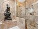Luxurious shower with marble accents and multiple shower heads at 1216 N Casey Key Rd, Osprey, FL 34229
