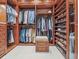 Spacious walk-in closet with custom shelving and hanging storage at 1216 N Casey Key Rd, Osprey, FL 34229