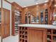 Large walk-in closet with custom shelving and ample storage space at 1216 N Casey Key Rd, Osprey, FL 34229