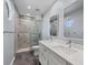 Modern bathroom with a glass shower, double sink vanity, and contemporary finishes at 1355 Debrecen Rd, Sarasota, FL 34240
