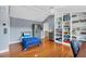 Bedroom with a built-in bookcase and hardwood flooring at 1355 Debrecen Rd, Sarasota, FL 34240