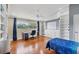 Bedroom with built-in shelving, desk, and hardwood flooring at 1355 Debrecen Rd, Sarasota, FL 34240