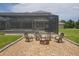Backyard fire pit surrounded by comfortable chairs, perfect for outdoor gatherings at 1355 Debrecen Rd, Sarasota, FL 34240