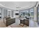 Spacious living room with built-in shelving and large windows, creating a comfortable and inviting atmosphere at 1355 Debrecen Rd, Sarasota, FL 34240