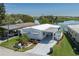 Aerial view of a charming single story home, covered parking, and landscaping at 1416 41St E Ave, Ellenton, FL 34222