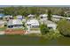 Waterfront homes with mature trees and vibrant landscaping offer scenic views from above at 1416 41St E Ave, Ellenton, FL 34222