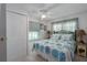 Comfortable bedroom with a ceiling fan, large closet, and serene decor at 1416 41St E Ave, Ellenton, FL 34222
