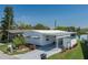 Charming single-story home with covered parking, landscaping, and a serene waterfront view at 1416 41St E Ave, Ellenton, FL 34222