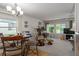Inviting living room and dining area with a view of the desk and entertainment center at 1416 41St E Ave, Ellenton, FL 34222
