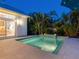 Private pool with stylish tiled accents and serene landscaping, perfect for relaxation and outdoor enjoyment at 144 Harrison Dr, Sarasota, FL 34236
