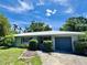 Inviting single-story home with manicured landscaping, a well-maintained lawn and a driveway leading to an attached garage at 1507 30Th W St, Bradenton, FL 34205