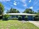 Inviting single-story home with manicured landscaping, a well-maintained lawn and a driveway leading to an attached garage at 1507 30Th W St, Bradenton, FL 34205