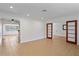 Open-concept living space with tile floors and arched doorways, offering a bright and airy feel at 1507 30Th W St, Bradenton, FL 34205