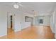 Open living area with tile flooring, white walls, and a view into the kitchen at 1507 30Th W St, Bradenton, FL 34205