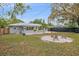 Spacious backyard with well maintained lawn, seating area, and a freshly painted exterior at 1507 30Th W St, Bradenton, FL 34205