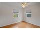 Bright bedroom featuring neutral colored walls, hardwood floors, and two windows at 1507 30Th W St, Bradenton, FL 34205