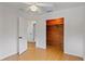 Bright bedroom featuring wood closet, ceiling fan, and white trim and doors at 1507 30Th W St, Bradenton, FL 34205