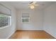 Well lit bedroom offering neutral colored walls, hardwood floors, and ceiling fan at 1507 30Th W St, Bradenton, FL 34205
