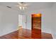 Bedroom with a wooden accent closet, hardwood floors, and a neutral color scheme at 1507 30Th W St, Bradenton, FL 34205