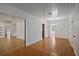 Elegant dining room with hardwood floors seamlessly flowing into adjacent rooms at 1507 30Th W St, Bradenton, FL 34205