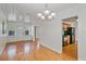 Elegant dining area with hardwood floors, seamlessly connected to the kitchen at 1507 30Th W St, Bradenton, FL 34205