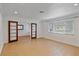 Open living room with tile floors, recessed lighting, and large windows at 1507 30Th W St, Bradenton, FL 34205