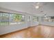 Bright living room featuring multiple windows, neutral walls, tile flooring and ceiling fans at 1507 30Th W St, Bradenton, FL 34205