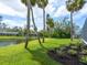 The backyard offers a peaceful waterfront setting with picturesque landscaping at 1575 Eastbrook Dr, Sarasota, FL 34231