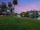Scenic backyard with a view of the water and surrounding lush landscape, perfect for outdoor enjoyment at 1575 Eastbrook Dr, Sarasota, FL 34231
