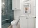 Bathroom with walk-in shower, modern fixtures, and stylish tile at 1575 Eastbrook Dr, Sarasota, FL 34231