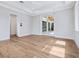 Spacious bedroom with hardwood floors and glass patio doors at 1575 Eastbrook Dr, Sarasota, FL 34231