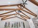 Dramatic ceiling with exposed beams, skylight and modern ceiling fans at 1575 Eastbrook Dr, Sarasota, FL 34231