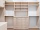 Custom closet with adjustable shelving, drawers, and hanging rods, providing ample storage space at 1575 Eastbrook Dr, Sarasota, FL 34231