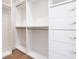 Well-organized closet with drawers and hanging rods, offering plenty of storage for clothes and accessories at 1575 Eastbrook Dr, Sarasota, FL 34231