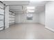 Clean, spacious garage with epoxy flooring and ample lighting at 1575 Eastbrook Dr, Sarasota, FL 34231