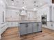 Well-appointed kitchen featuring a center island, pendant lighting and modern appliances at 1575 Eastbrook Dr, Sarasota, FL 34231