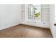 Bright office with built in bookcase and cabinets with hardwood floors at 1575 Eastbrook Dr, Sarasota, FL 34231