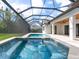 A screened pool and hot tub offer the ultimate outdoor enjoyment at 1575 Eastbrook Dr, Sarasota, FL 34231